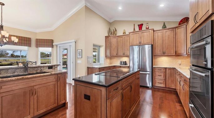 Chandelier, Interior, Kitchen, Pendant Lights, Recessed Lighting, Stainless Steel Appliances, Wood Texture Flooring