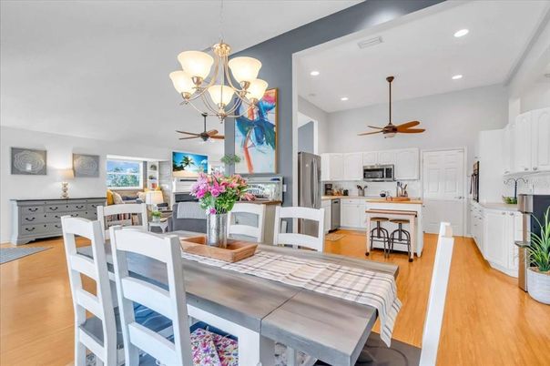 Chandelier, Dining room, Interior, Kitchen, Recessed Lighting, Tile Countertops, Wood Texture Flooring