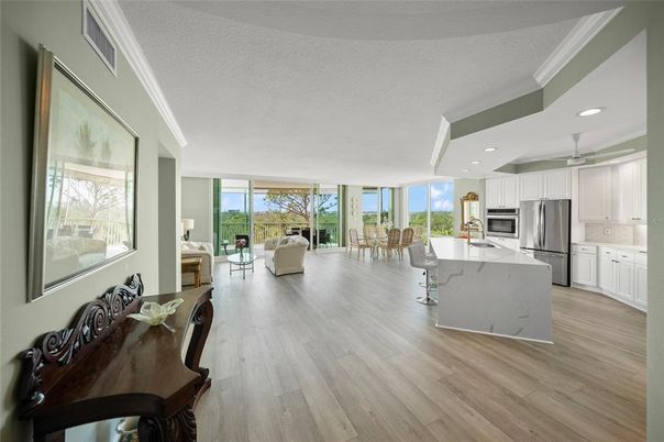 Dining room, Interior, Kitchen, Living room, Recessed Lighting, Stainless Steel Appliances, Wood Texture Flooring