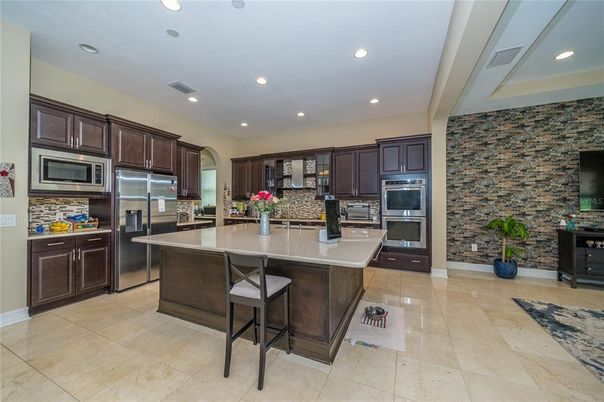Interior, Kitchen, Recessed Lighting, Stainless Steel Appliances, Stone Walls