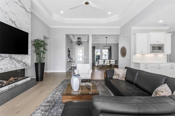 Dining room, Fireplace, Interior, Kitchen, Living room, Marble Walls, Pendant Lights, Recessed Lighting, Wood Texture Flooring