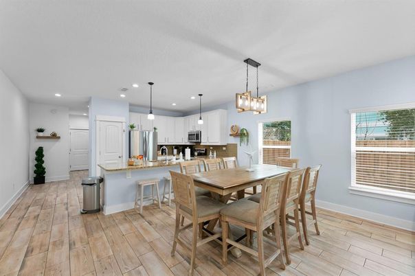 Dining room, Interior, Kitchen, Pendant Lights, Recessed Lighting, Stainless Steel Appliances, Wood Texture Flooring