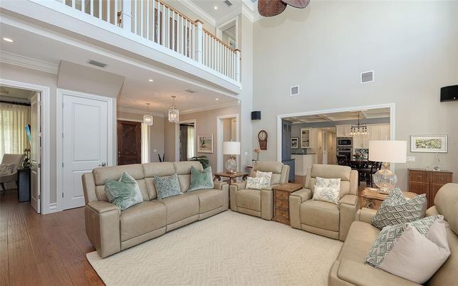 Chandelier, Dining room, Interior, Kitchen, Living room, Pendant Lights, Recessed Lighting, Stainless Steel Appliances, Wood Texture Flooring