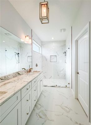 Bathroom, Dual Sink Vanities, Glass Shower, Interior, Marble, Marble Walls, Recessed Lighting