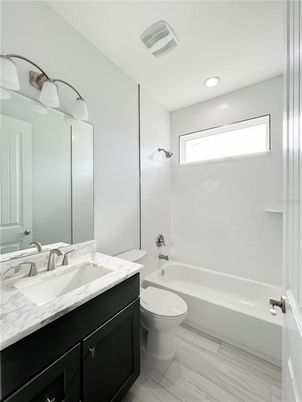 Bathroom, Dual Sink Vanities, Interior, Recessed Lighting, Wood Texture Flooring