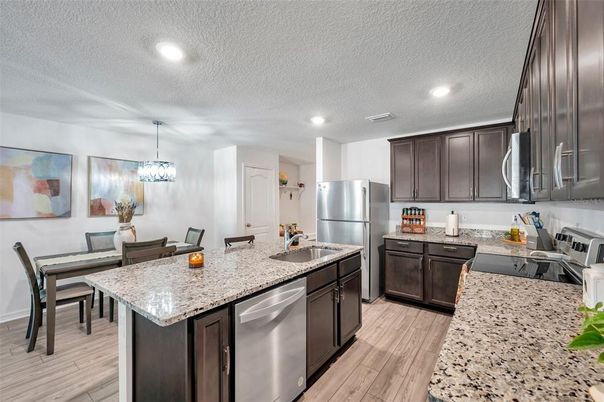 Dining room, Interior, Kitchen, Pendant Lights, Recessed Lighting, Stainless Steel Appliances, Wood Texture Flooring