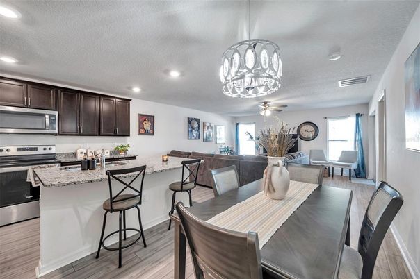 Dining room, Interior, Kitchen, Pendant Lights, Recessed Lighting, Stainless Steel Appliances, Wood Texture Flooring