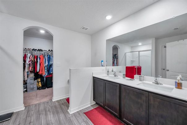 Bathroom, Dual Sink Vanities, Interior, Recessed Lighting, Walk-in Closets, Wood Texture Flooring