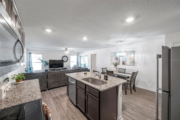 Chandelier, Dining room, Interior, Kitchen, Living room, Recessed Lighting, Wood Texture Flooring
