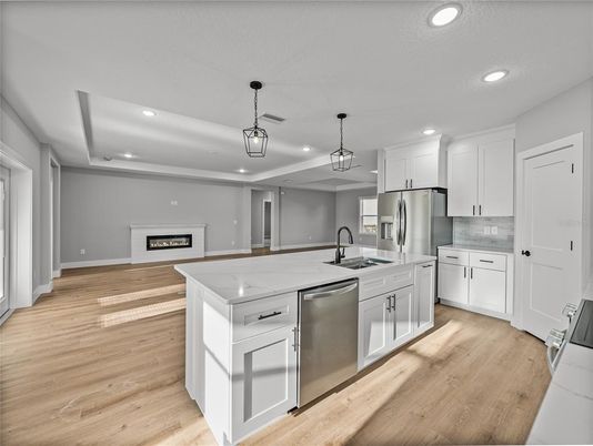 Fireplace, Interior, Kitchen, Pendant Lights, Recessed Lighting, Stainless Steel Appliances, Wood Texture Flooring