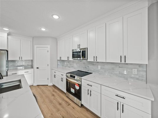 Interior, Kitchen, Recessed Lighting, Stainless Steel Appliances, Wood Texture Flooring