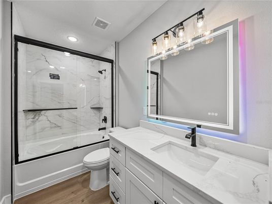 Bathroom, Glass Shower, Interior, Marble Walls, Recessed Lighting, Wood Texture Flooring