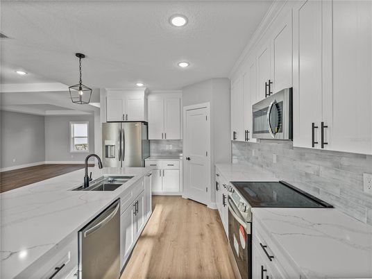 Interior, Kitchen, Pendant Lights, Recessed Lighting, Stainless Steel Appliances, Wood Texture Flooring