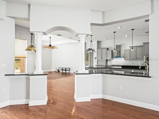 Dining room, Interior, Kitchen, Pendant Lights, Recessed Lighting, Stainless Steel Appliances, Wood Texture Flooring