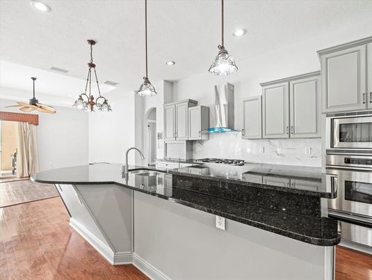 Interior, Kitchen, Pendant Lights, Recessed Lighting, Stainless Steel Appliances, Wood Texture Flooring