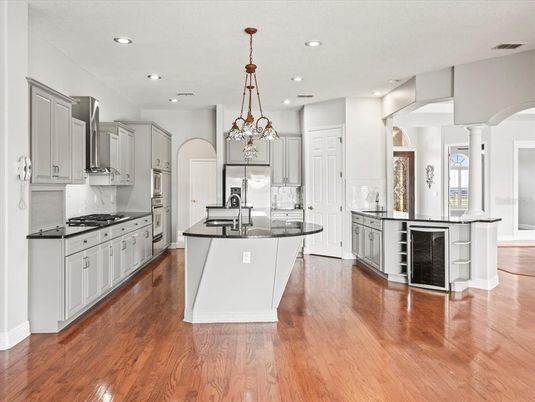 Chandelier, Interior, Kitchen, Pendant Lights, Recessed Lighting, Stainless Steel Appliances, Wood Texture Flooring