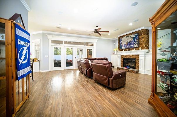Fireplace, Interior, Living room, Recessed Lighting, Stone Walls, Wood Texture Flooring