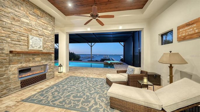 Fireplace, Interior, Living room, Recessed Lighting, Stone Walls, Water, Wooden Ceilings