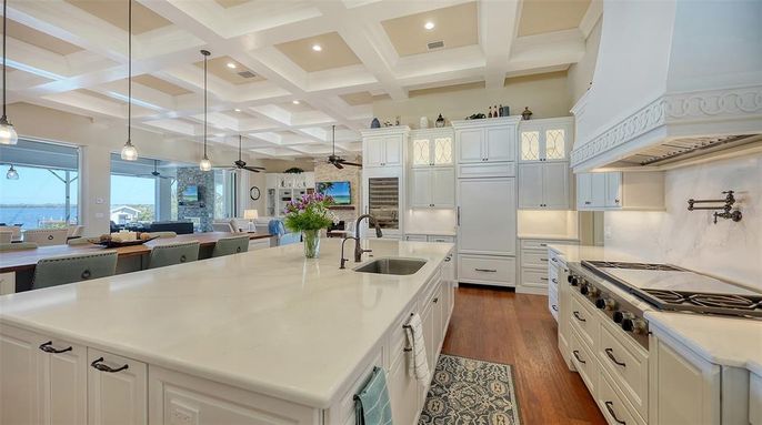 Dining room, Interior, Kitchen, Pendant Lights, Recessed Lighting, Stainless Steel Appliances, Water, Wood Texture Flooring
