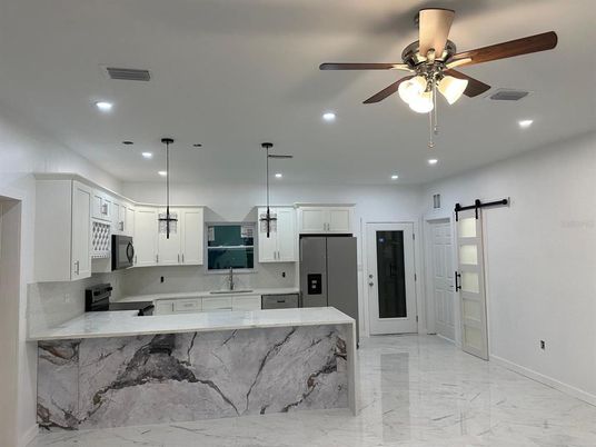 Interior, Kitchen, Marble, Pendant Lights, Recessed Lighting, Stainless Steel Appliances