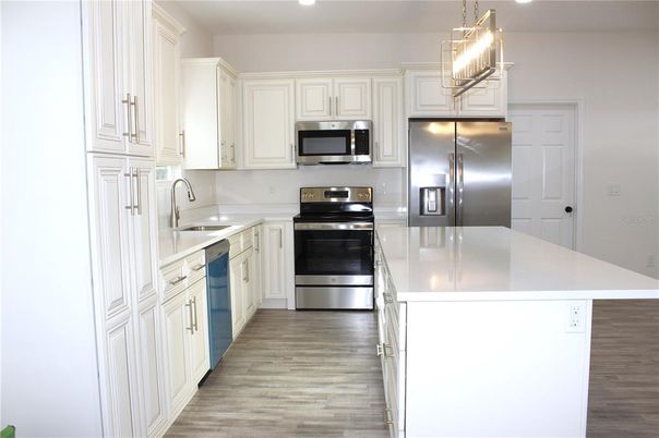 Interior, Kitchen, Pendant Lights, Recessed Lighting, Stainless Steel Appliances, Wood Texture Flooring