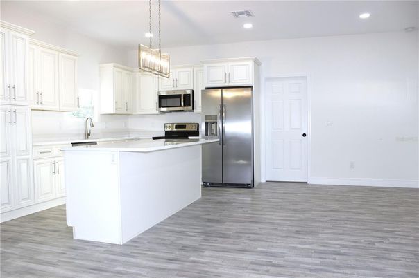Interior, Kitchen, Pendant Lights, Recessed Lighting, Stainless Steel Appliances, Wood Texture Flooring