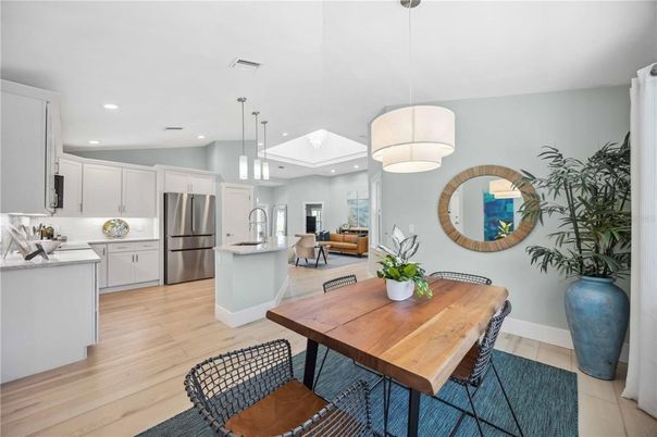 Dining room, Interior, Kitchen, Living room, Pendant Lights, Recessed Lighting, Stainless Steel Appliances, Wood Texture Flooring