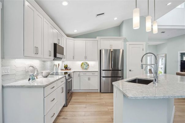 Interior, Kitchen, Pendant Lights, Recessed Lighting, Stainless Steel Appliances, Wood Texture Flooring