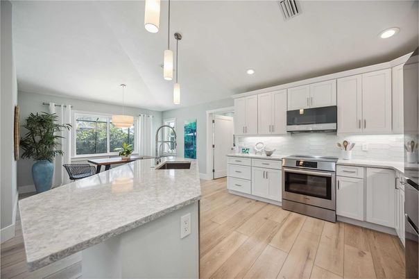 Interior, Kitchen, Pendant Lights, Recessed Lighting, Stainless Steel Appliances, Wood Texture Flooring