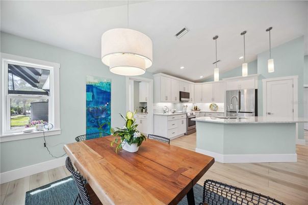Dining room, Interior, Kitchen, Pendant Lights, Recessed Lighting, Stainless Steel Appliances, Wood Texture Flooring
