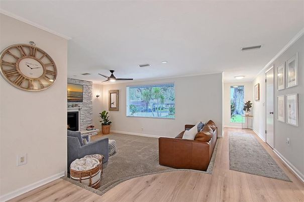 Fireplace, Interior, Living room, Recessed Lighting, Stone Walls, Wood Texture Flooring