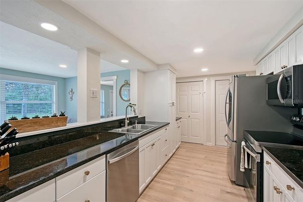 Interior, Kitchen, Recessed Lighting, Stainless Steel Appliances, Wood Texture Flooring