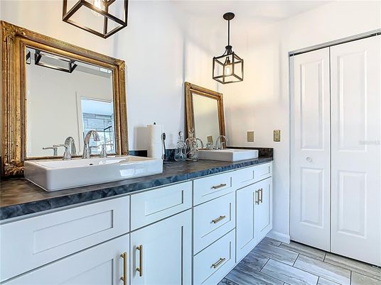 Bathroom, Dual Sink Vanities, Interior, Pendant Lights, Wood Texture Flooring
