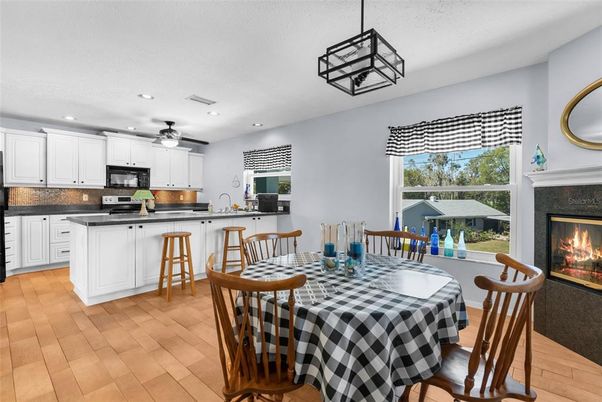 Dining room, Fireplace, Interior, Kitchen, Pendant Lights, Recessed Lighting, Wood Texture Flooring