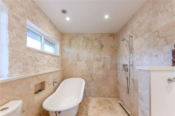 Bathroom, Free Standing Baths, Interior, Recessed Lighting, Stone Walls