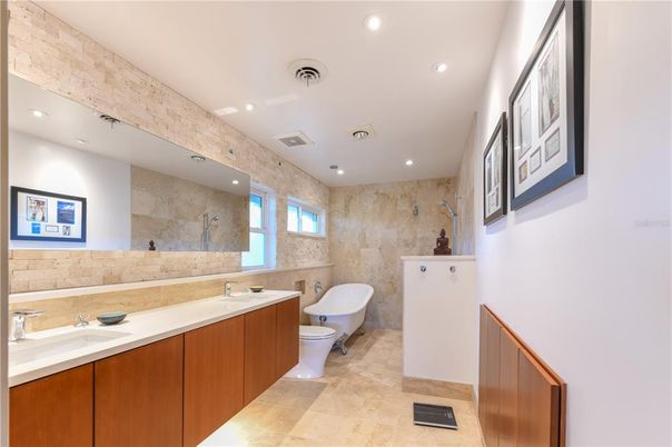 Bathroom, Dual Sink Vanities, Free Standing Baths, Interior, Recessed Lighting, Stone Walls