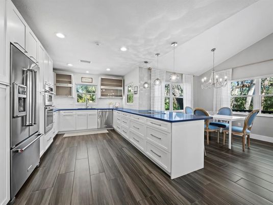 Chandelier, Dining room, Interior, Kitchen, Pendant Lights, Recessed Lighting, Stainless Steel Appliances, Wood Texture Flooring
