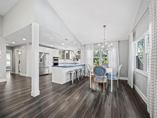 Chandelier, Dining room, Interior, Kitchen, Pendant Lights, Recessed Lighting, Stainless Steel Appliances, Wood Texture Flooring