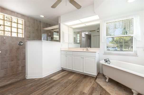 Bathroom, Dual Sink Vanities, Free Standing Baths, Glass Shower, Interior, Recessed Lighting, Wood Texture Flooring