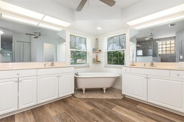Bathroom, Dual Sink Vanities, Free Standing Baths, Glass Shower, Interior, Recessed Lighting, Wood Texture Flooring