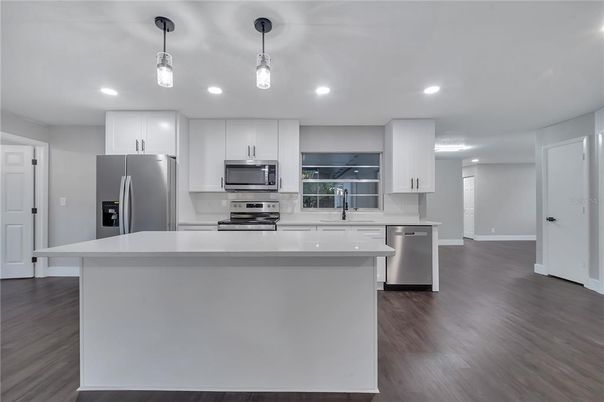 Interior, Kitchen, Pendant Lights, Recessed Lighting, Stainless Steel Appliances, Wood Texture Flooring