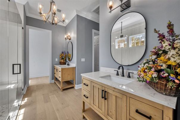 Bathroom, Chandelier, Dual Sink Vanities, Interior, Wood Texture Flooring