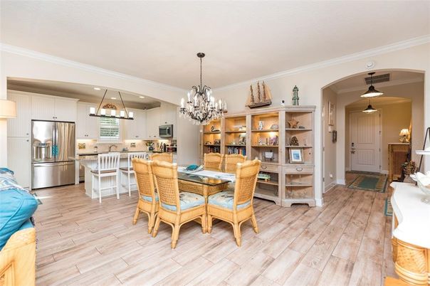 Chandelier, Dining room, Interior, Kitchen, Pendant Lights, Recessed Lighting, Stainless Steel Appliances, Wood Texture Flooring
