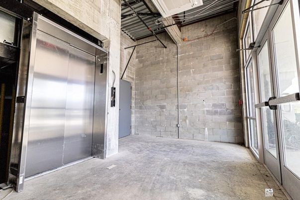 Elevator, Garage, Interior, Stone Walls