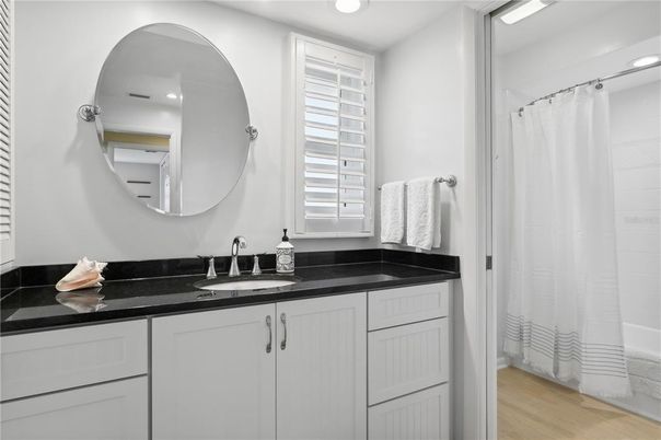 Bathroom, Dual Sink Vanities, Interior, Recessed Lighting, Wood Texture Flooring