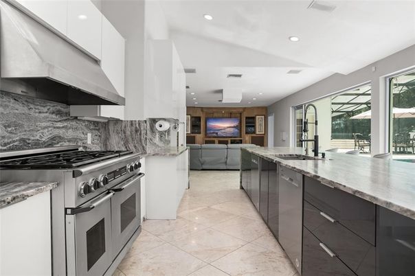 Interior, Kitchen, Marble Walls, Recessed Lighting, Stainless Steel Appliances