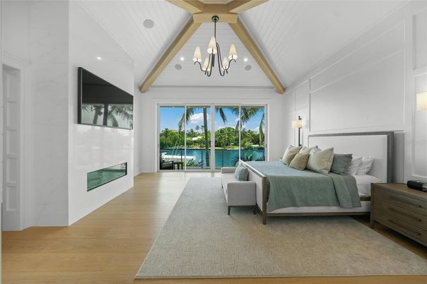 Bedroom, Chandelier, Fireplace, Interior, Recessed Lighting, Wood Texture Flooring