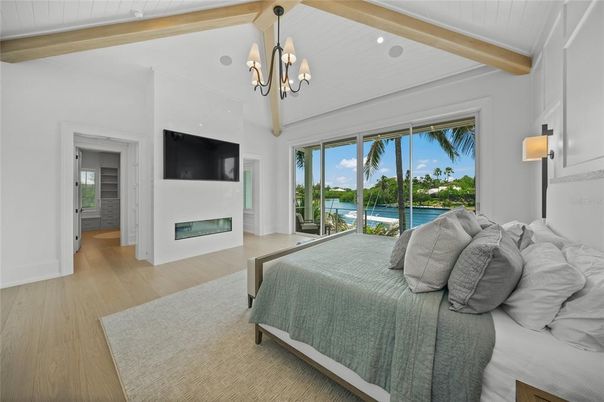 Bedroom, Chandelier, Fireplace, Interior, Recessed Lighting, Water, Wooden Beams, Wood Texture Flooring