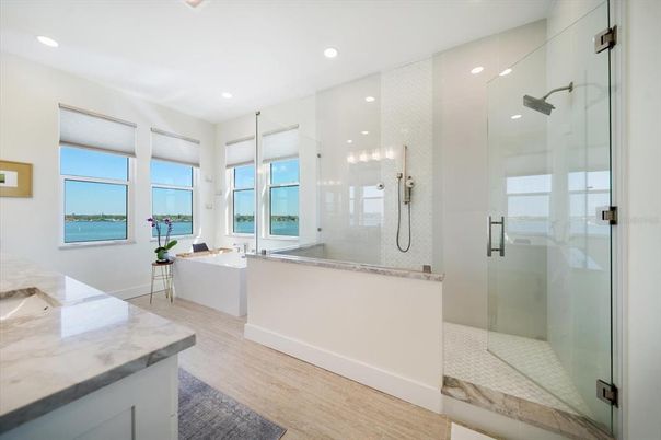 Bathroom, Dual Sink Vanities, Glass Shower, Interior, Recessed Lighting, Wood Texture Flooring
