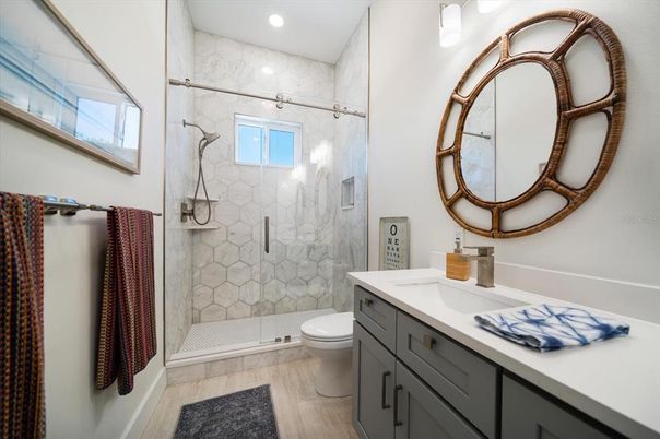 Bathroom, Glass Shower, Interior, Marble Walls, Recessed Lighting, Wood Texture Flooring